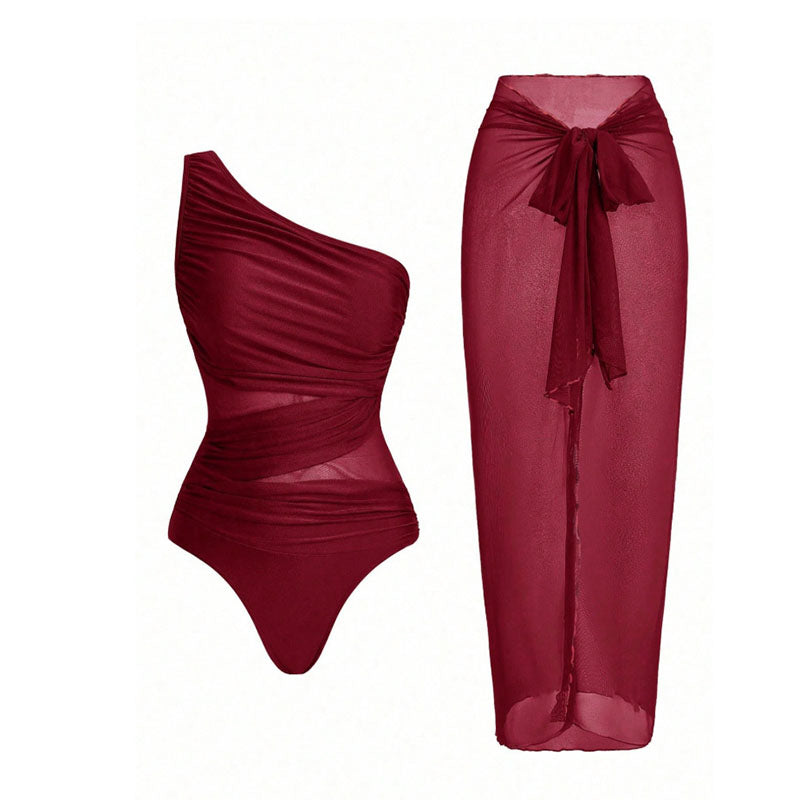 One-shoulder cut-out one-piece swimsuit and mesh cover-up skirt set